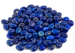 A pile of Lapis lazuli gemstone tumble stones 