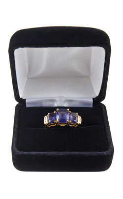 Iolite ring in a blue jewelry cushioned case indicating the type of gifts that can be purchased for the 21st wedding anniversary