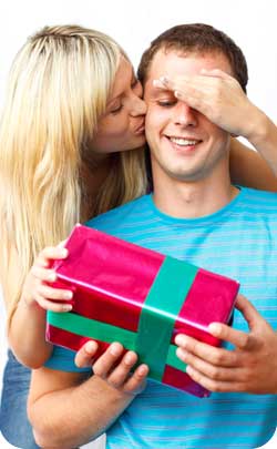 kissing couple giving anniversary gift